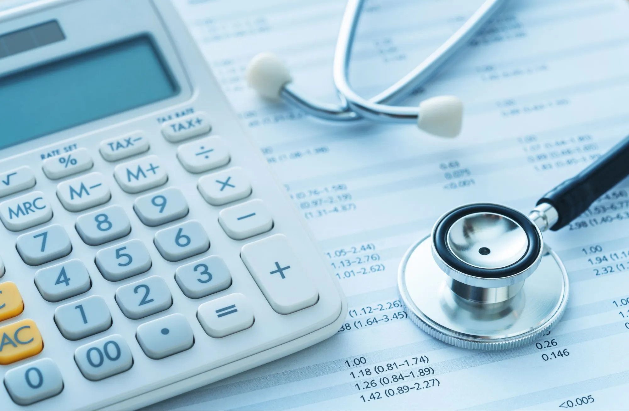 Calculator and stethoscope - Healthcare affordability